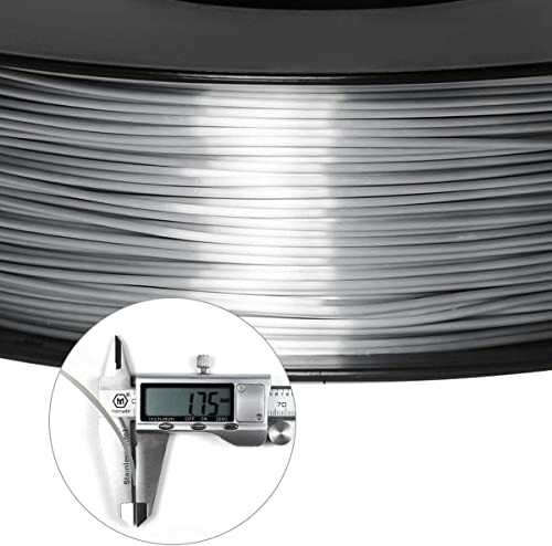 3D printer filament with digital caliper showing diameter.