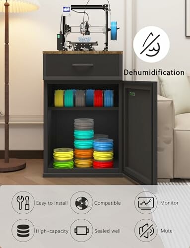 3D printer filament storage cabinet with dehumidification feature and multiple filaments stored inside.