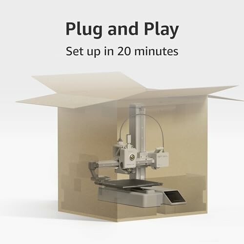 3D printer setup illustration in a cardboard box, showcasing the compact size and sleek design of the Bambu Lab A1 Mini Combo.