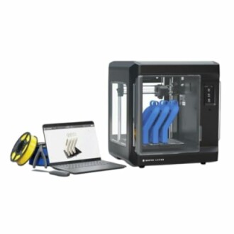 3D printer with laptop and filament spools.