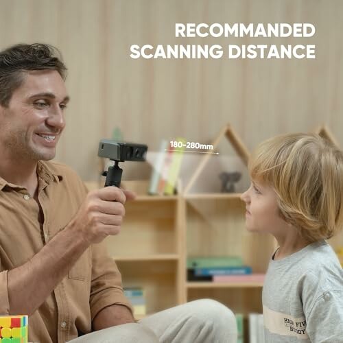 Adult demonstrating 3D scanner to child with recommended scanning distance displayed.