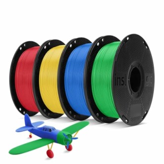 Four spools of colorful 3D printing filament with a toy airplane.