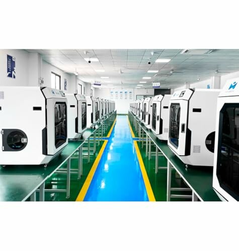 Row of machines in a factory setting with a blue and green floor