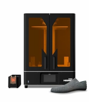 Large 3D printer with a printed shoe in front.