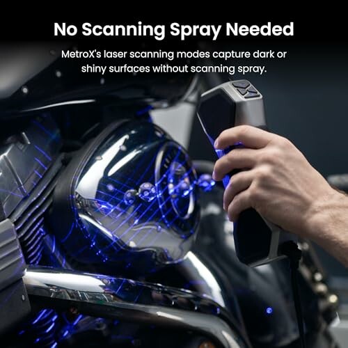 Hand using a laser scanner on a motorcycle engine.