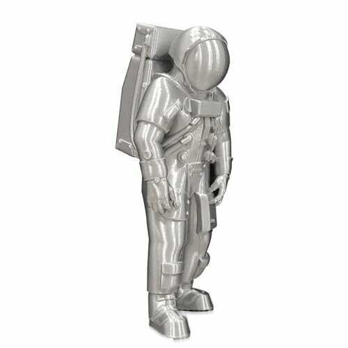 Metallic astronaut figurine in spacesuit.