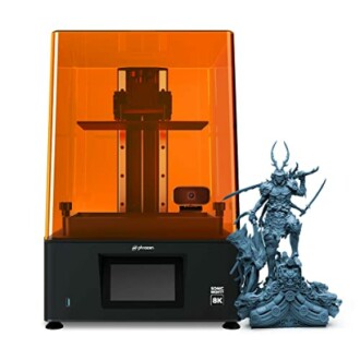 Resin 3D printer with a detailed figurine model.